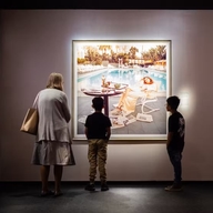 Fotografiska berlin grandmother and kids looking at photo